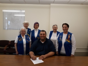 Mayor David Estes of Reedsburg signs the Buddy Poppy Proclamation for the Thurber-Greenwood VFW Post 1916 Auxiliary on May 6 because it is Buddy Poppy Month. The proclamation recognizes the poppy distribution project, which strives to remind Americans of those who’ve sacrificed and died for their country. Veteran volunteers will offer poppy decorations at area stores for donation, and the mayor encourages as many people as possible to wear one in honor of veterans and their contributions. May is Buddy Poppy