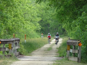 Cyclists ride into La Valle on the 400 State Trail on Saturday.