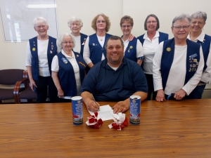 Mayor Dave Estes signed a proclamation declaring the week of May 27 as Poppy Week in Reedsburg.  In the photo are American Legion Auxiliary members Kathy Horkan, Joanne Biesek, Diana Dalton, LaReta Dischler, Ardell Albers, Robin Boland, Pat Schorer and Annette Baker. (Submitted photo)