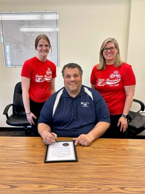 Mayor Dave Estes, with water safety experts Angie Fry and Marina Peterson of Swim Reedsburg, signs a proclamation recognizing National Water Safety Month. Swim Reedsburg and the National Drowning Prevention Alliance are collaborating to warn parents and caregivers about the risks of water and children. Drowning is the leading cause of death and disability in children under age 5, and near-drowning incidents can lead to life-long medical issues. (Submitted photo)