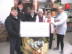 On Dec. 11, VFW members presented a check for $500 and a grocery basket full of non-perishable items collected from past breakfasts to the Reedsburg Area Food Pantry. From Left are John Noga, Wayne Unrath, Pete Link, Erna Wallace, Shirley Henry and Deb Heyerdahl. (Submitted photo)