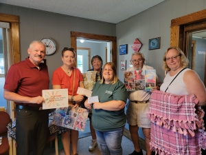 Project Warm Hugs was selected as IMT’s Community Contest winner. The prize was $500. Richards Insurance matched the award. Project Warm Hugs provides fleece blankets to hospitals in the region to distribute to child patients. (Submitted photo)