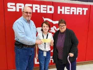 Knights of Columbus Council No. 3805 Reedsburg donated $500 to the Sacred Heart School Gala to help replace playground equipment at the Mazzuchelli Early Child Care Facility. The donation is one of severl ways the Knights of Columbus help Sacred Heart School every year. The gala features several prizes, including the opportunity to be Principal for a Day. Levi Kraemer, a fifth grader at Sacred Heart, won the prize. He is the son of Jason and Sally Kraemer. Seen here are, from left, Dennis Rose, treasurer of