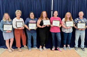 Five years: Mikaela Tourdot, Jennifer Gibbons, Yessica Ramierez Lopez, Stephanie Whitney, Sarah Slaats, Kaitlyn Merfeld, and Gary Mortimer. Not pictured: Breanna Hale, Jeff Johnson, and Tom Kowalke.