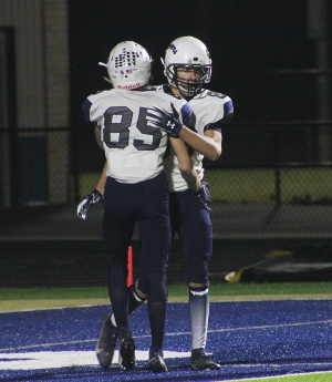 Caden Brandt, right, celebrates with teammate Brady Mikonowicz (No. 85) after Brandt hauled in a TD pass from QB Bryant Yanke for the Beaver football team in Friday’s contest at Lake Mills. Reedsburg ends the season at 2-5 after a 51-14 loss on Friday. (Photo by Troy Matz)